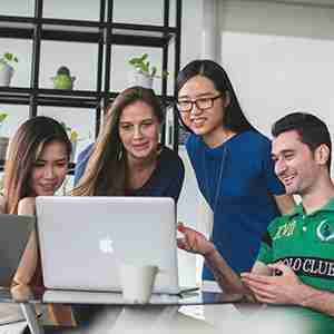 group-of-people-talking-with-laptops